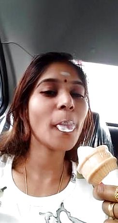 Indian lady throating icecream like lollipop